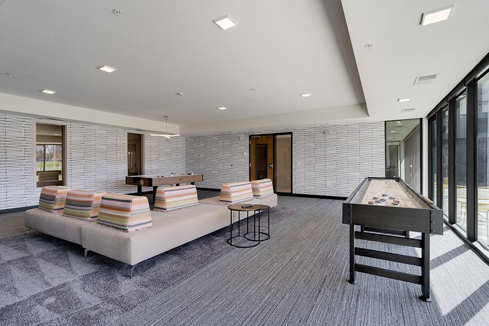 a game room with a foosball table and a pool table