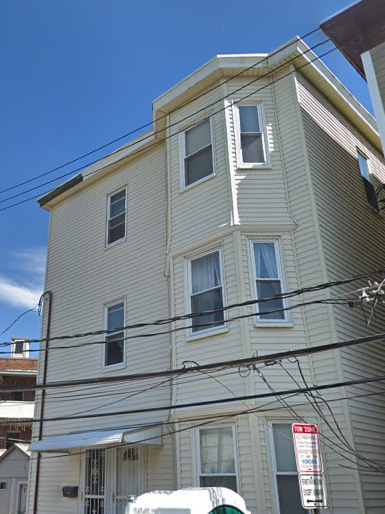 a white building on the corner of a street