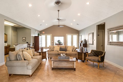 A living room with a couch, chair, and coffee table.