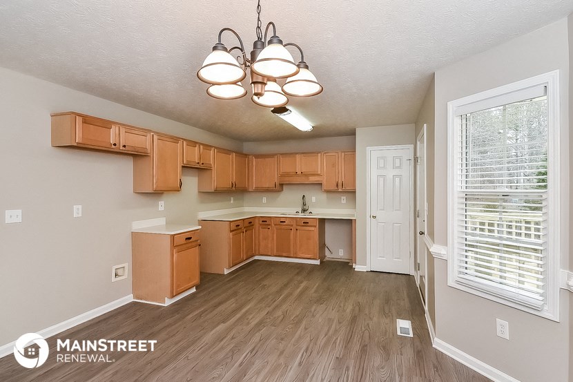 the kitchen and living room of a rental house