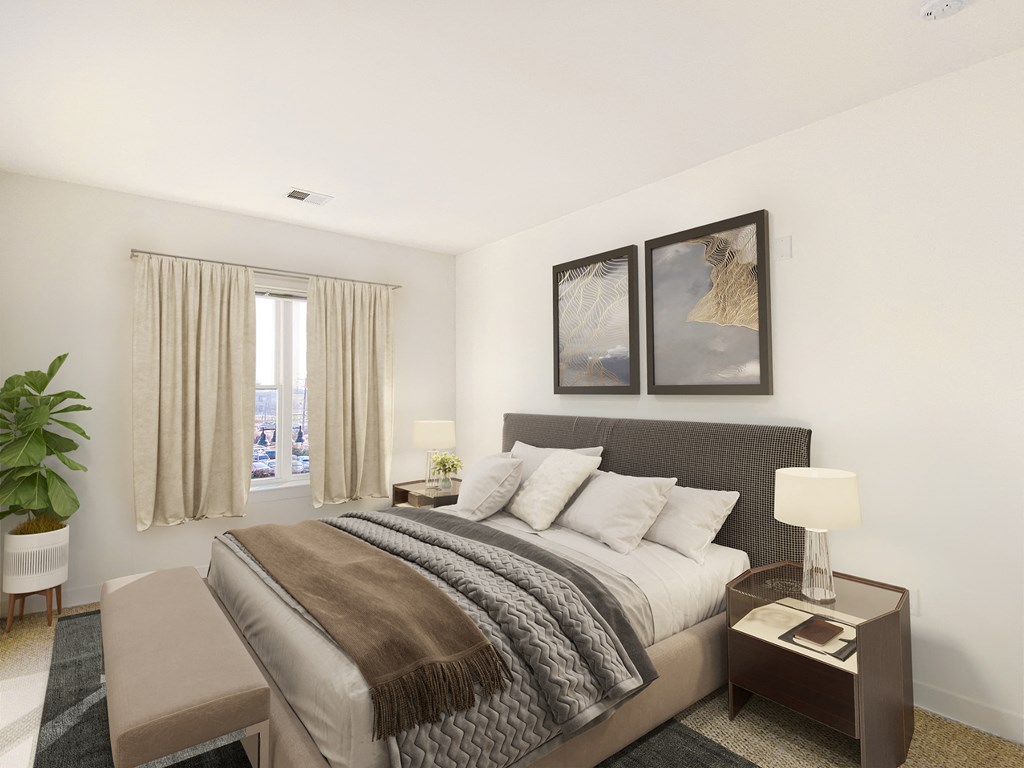 a bedroom with a large bed and a window
