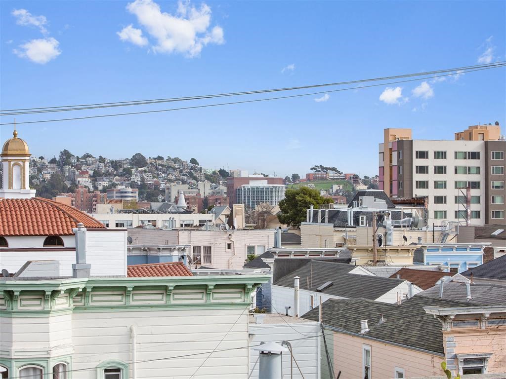 the view of the city from the roof of a building