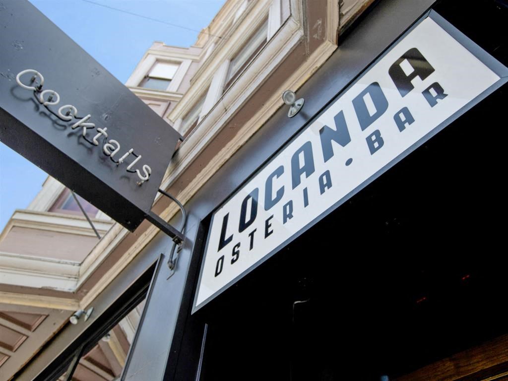 a black and white sign on the side of a building