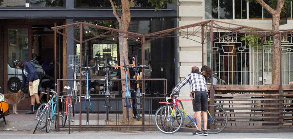 a man is standing next to a bike