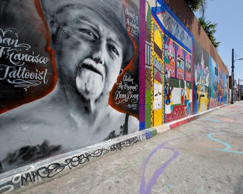 a mural of a man on the side of a wall
