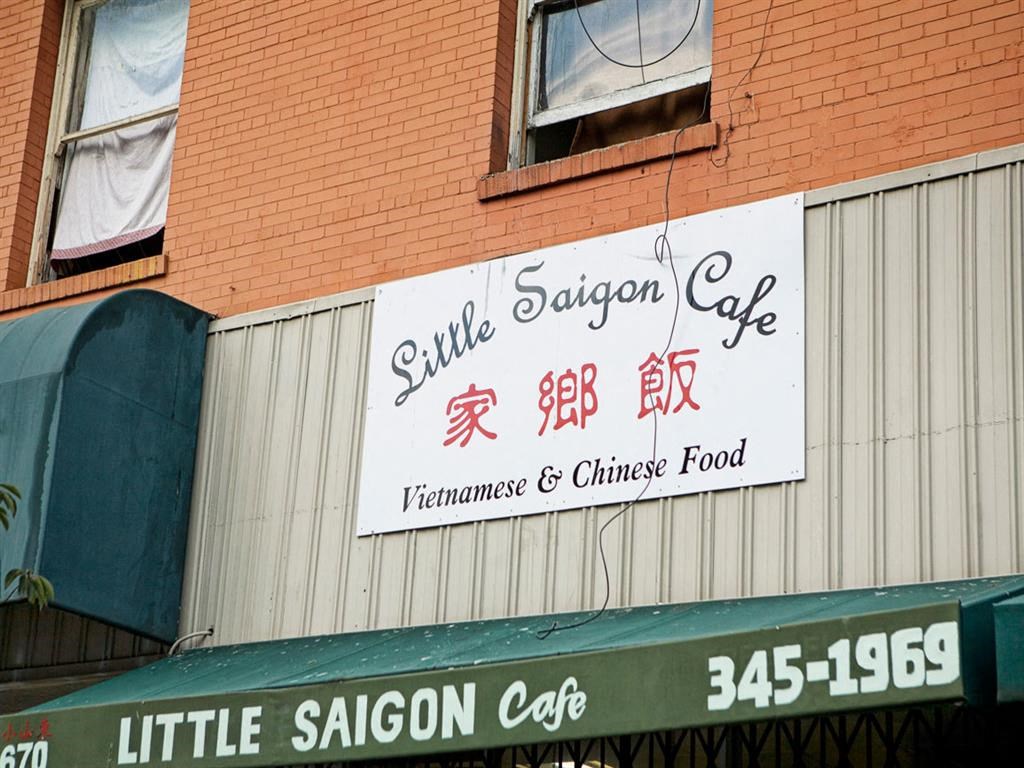 a sign for a restaurant on the side of a building