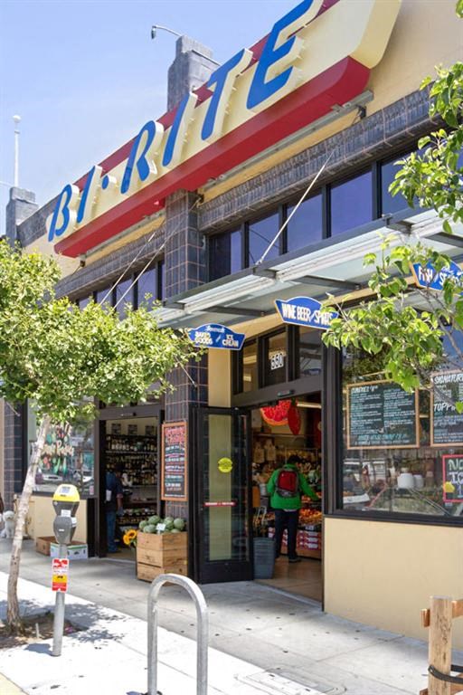 the front of a bar rite store on a city street