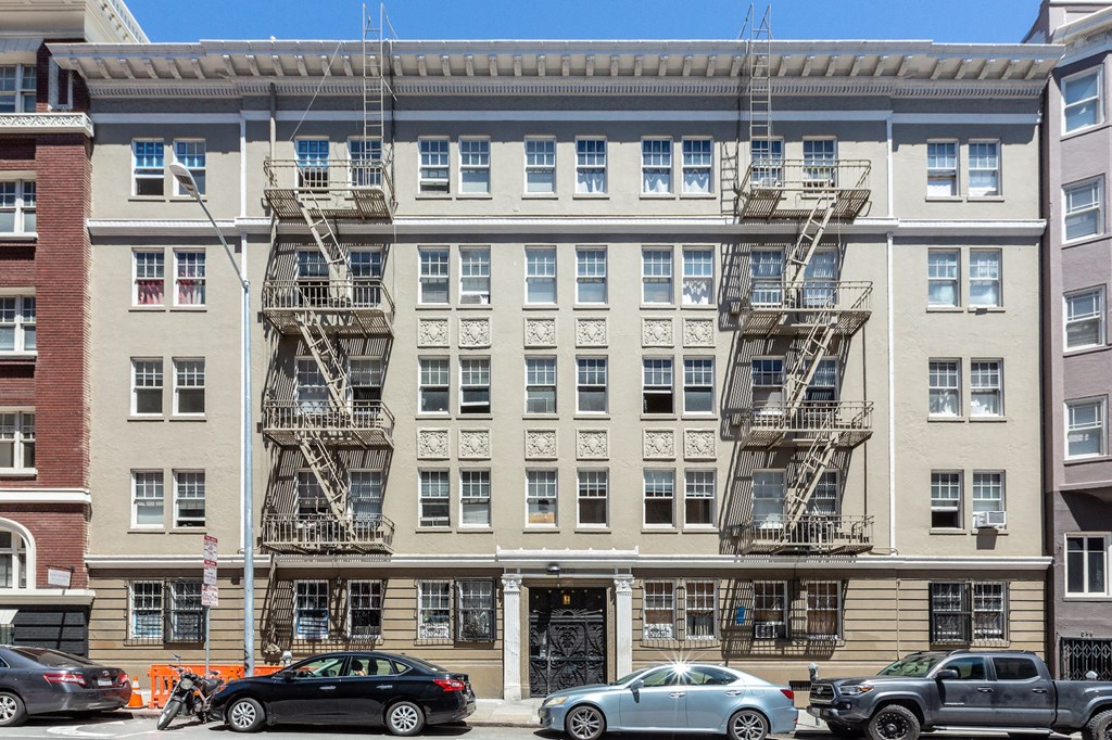 a large apartment building with a fire escape