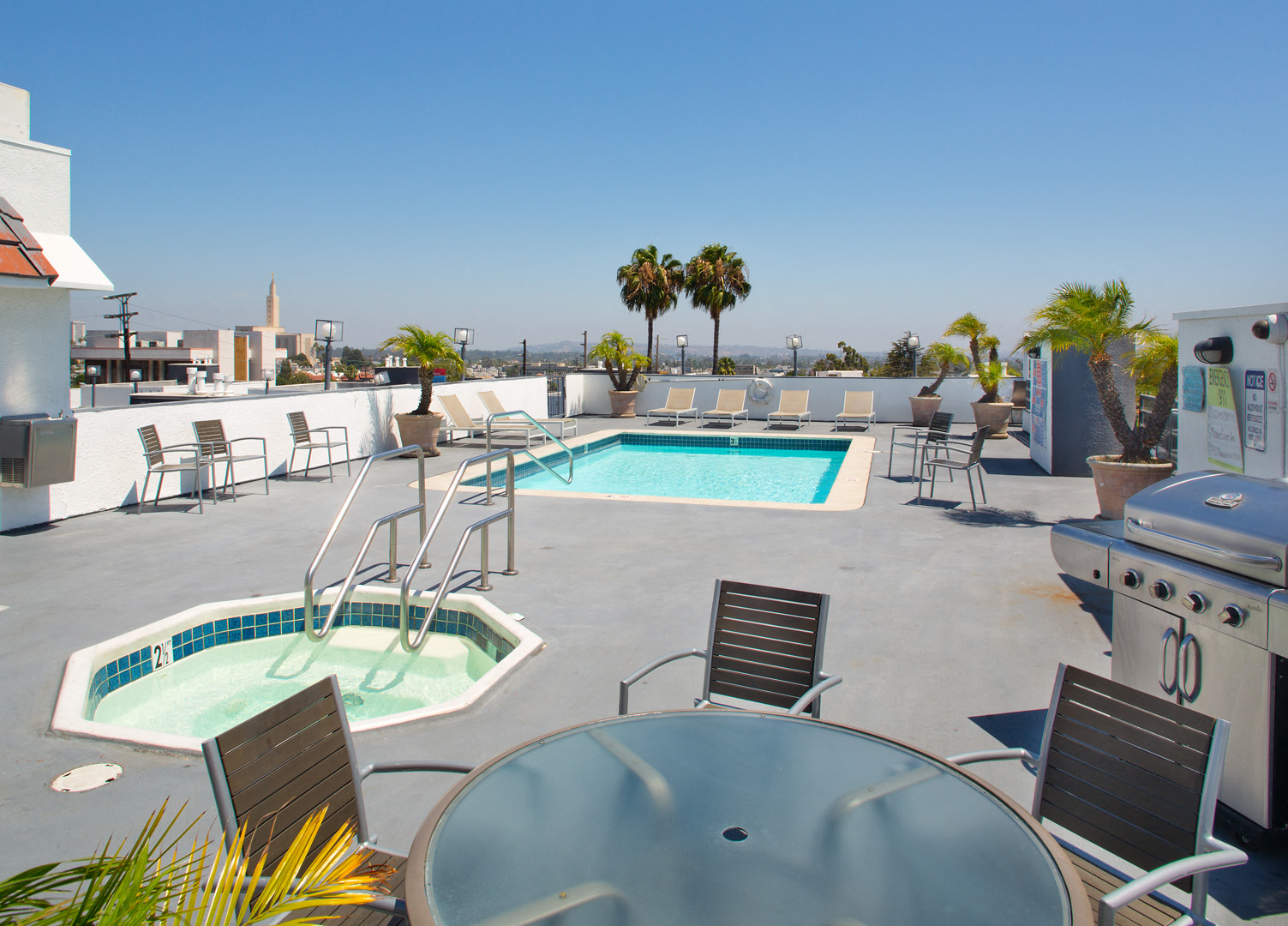 a pool and hot tub on the roof of a building