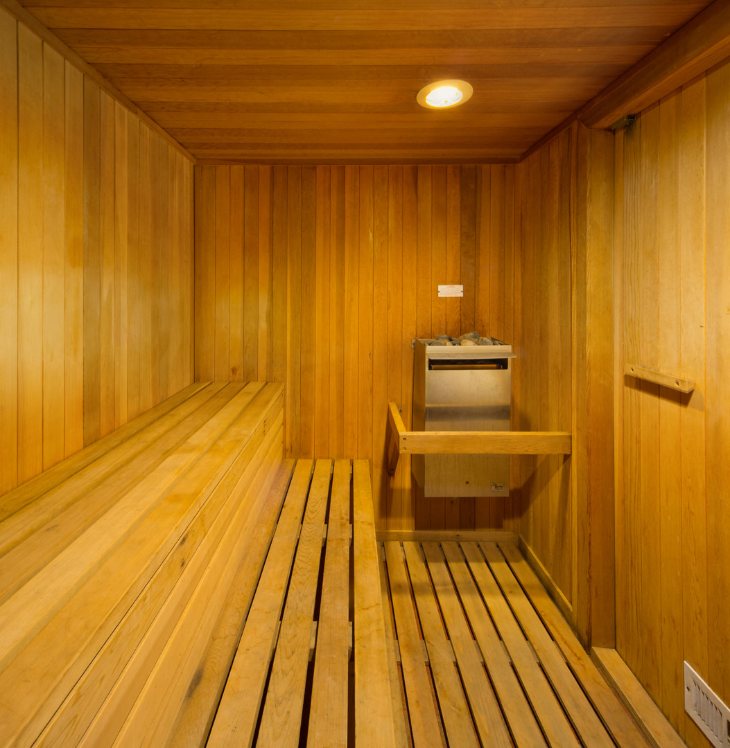 a wooden sauna with a stove in it