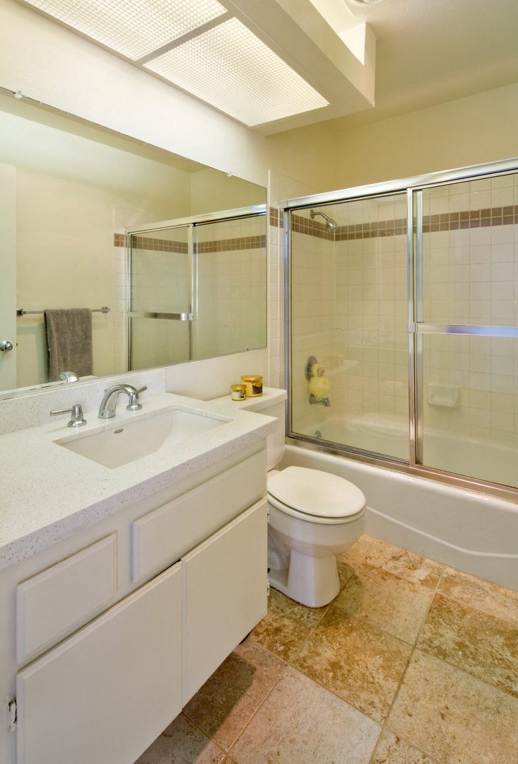 a bathroom with a toilet sink and shower