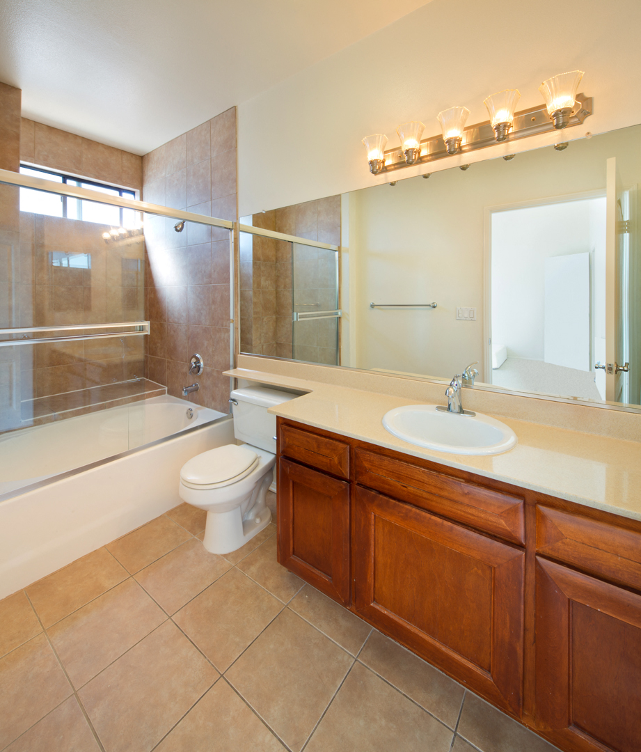 a bathroom with a sink toilet and a shower