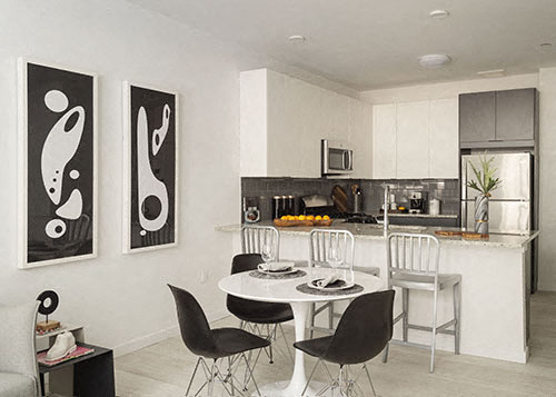 a kitchen and dining room with a table and chairs