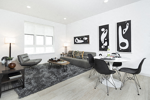 a living room with a table and chairs and a couch