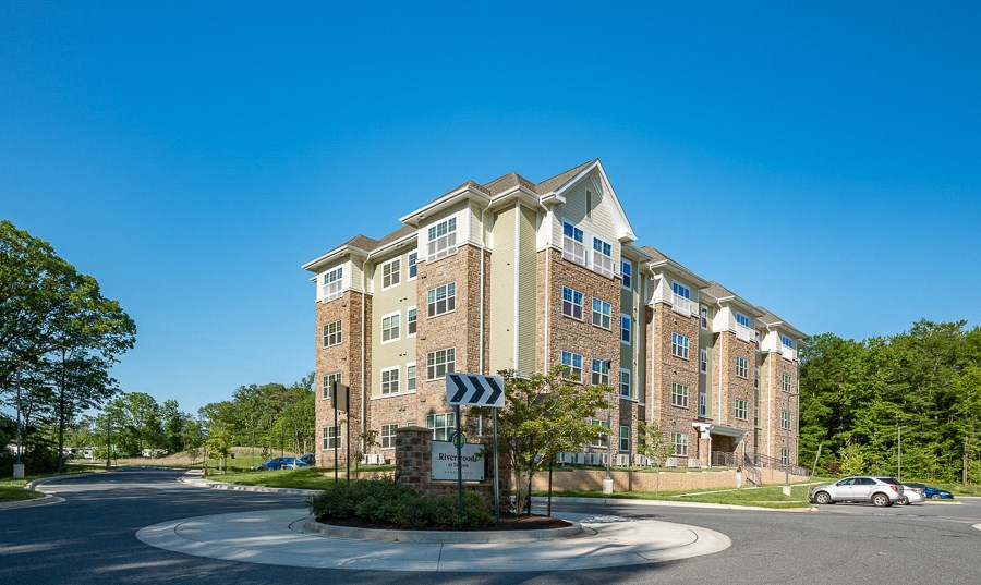 an apartment building on the corner of a street