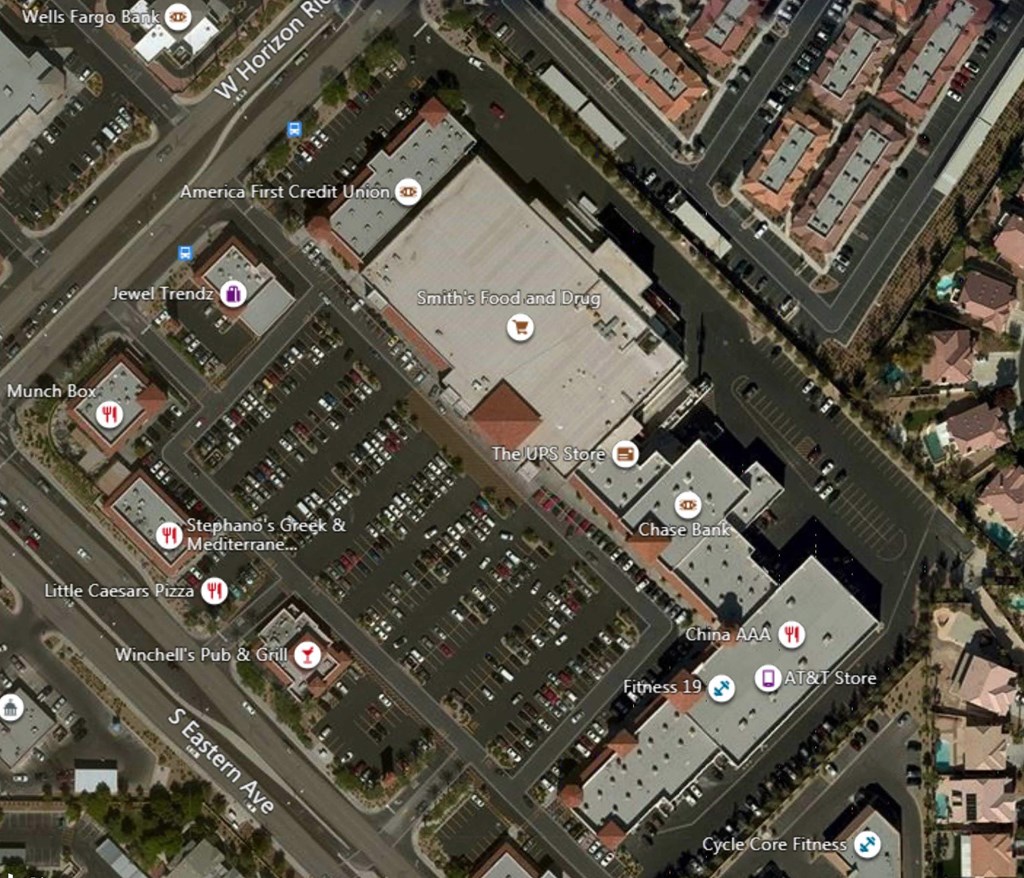 An aerial view of a shopping area with stores like Jewel Trends and AT&T Store.