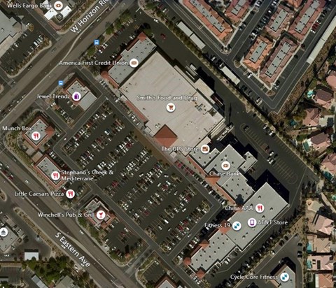 An aerial view of a shopping area with stores like Jewel Trends and AT&T Store.