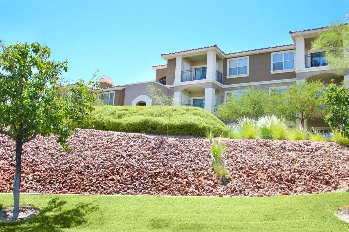 the front of a house with a landscaped yard