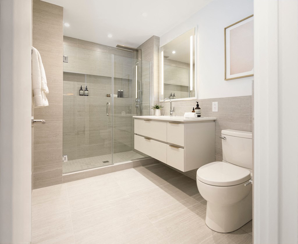 a bathroom with a toilet and a shower