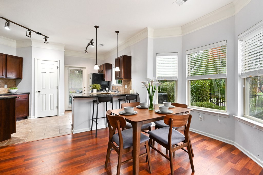 an open kitchen and dining room with a table and chairs