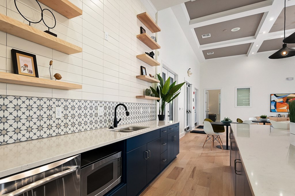 a kitchen with a large counter top and a sink