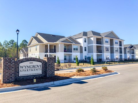 an apartment building with a sign that reads winggrove apartments