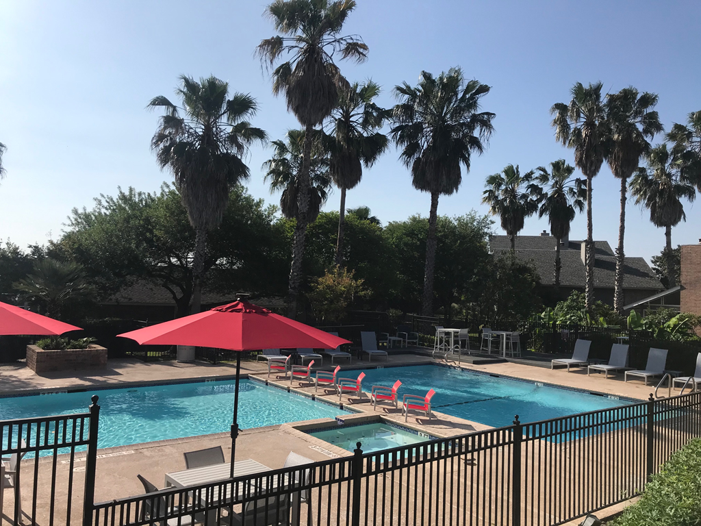 red umbrella near pool