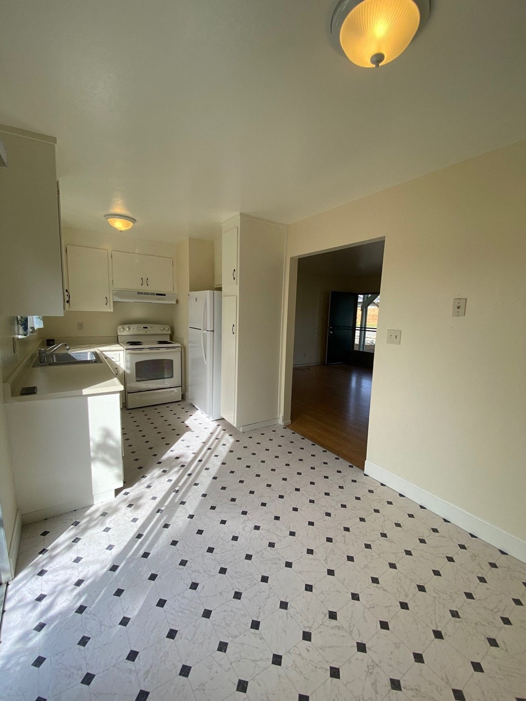 a view of a kitchen from the living room