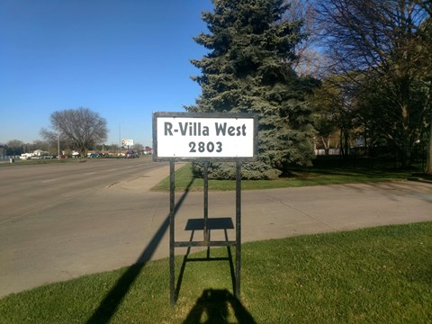 a street sign sitting on the side of a road