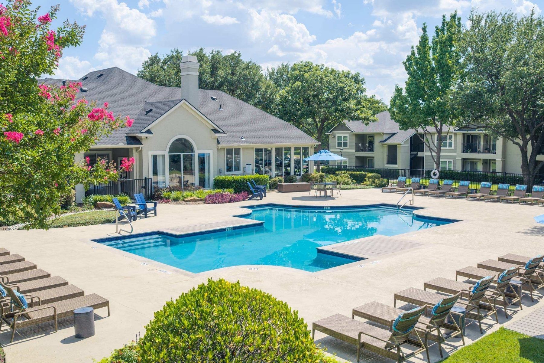 A large house with a pool in the backyard.