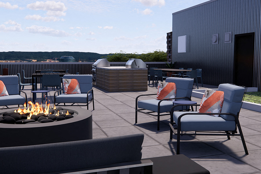 Downtown Seattle apartments - Neptune Rooftop lounge area with grills and views of Lake Union