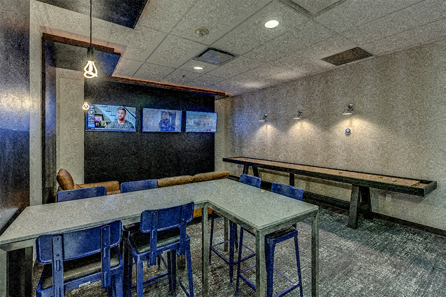 UW apartments in Seattle - Neptune SLU Apartments Entertainment suite with shuffleboard and billiards table