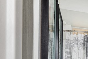 Bathrooms feature wood grain cabinets and framed mirrors North Scottsdale Apartments - San Carlos - Bathrooms feature wood grain cabinets and framed mirrors - Photo Gallery 3