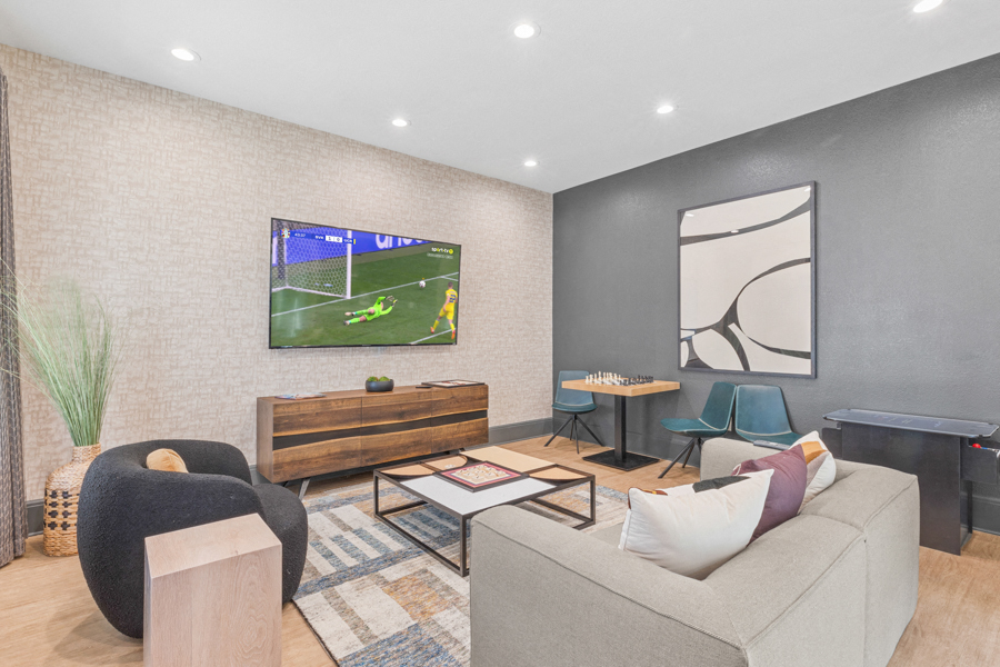 a living room with a couch and a tv