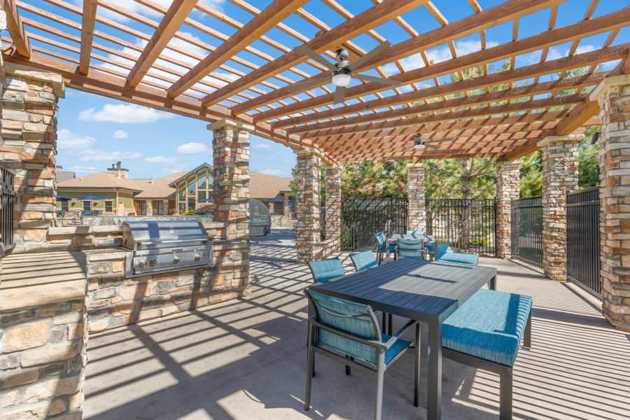 The Sanctuary at Tallyns Reach Apartments in Aurora, CO - pavilion with bbq grills