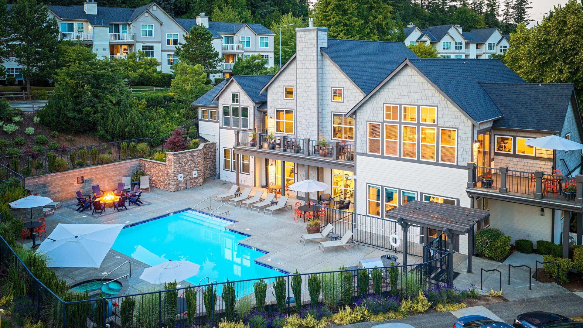 A large house with a pool in the backyard.