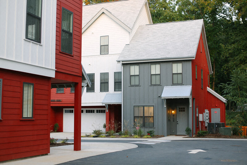 a row of houses with red and white roofs