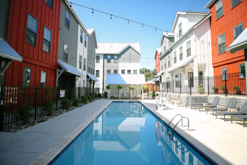 a swimming pool is between two buildings