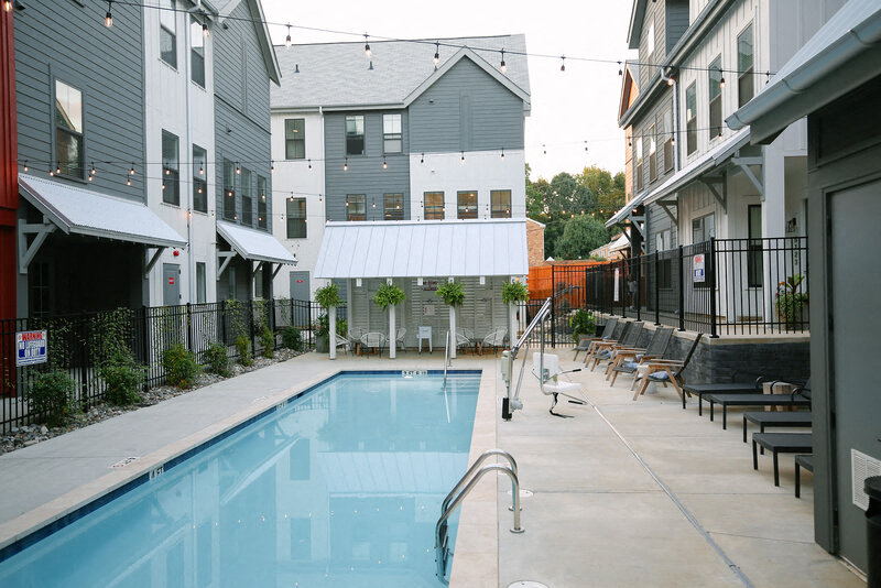 a swimming pool in the middle of some buildings