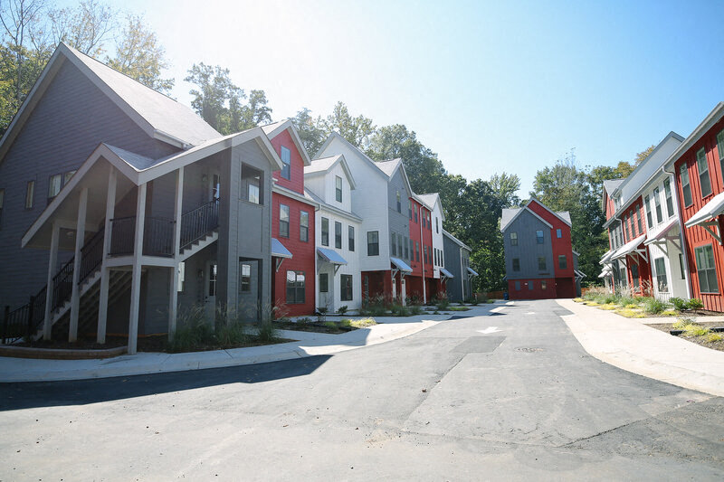 a row of houses on the side of a street