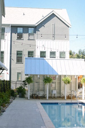 a house with a swimming pool in front of it