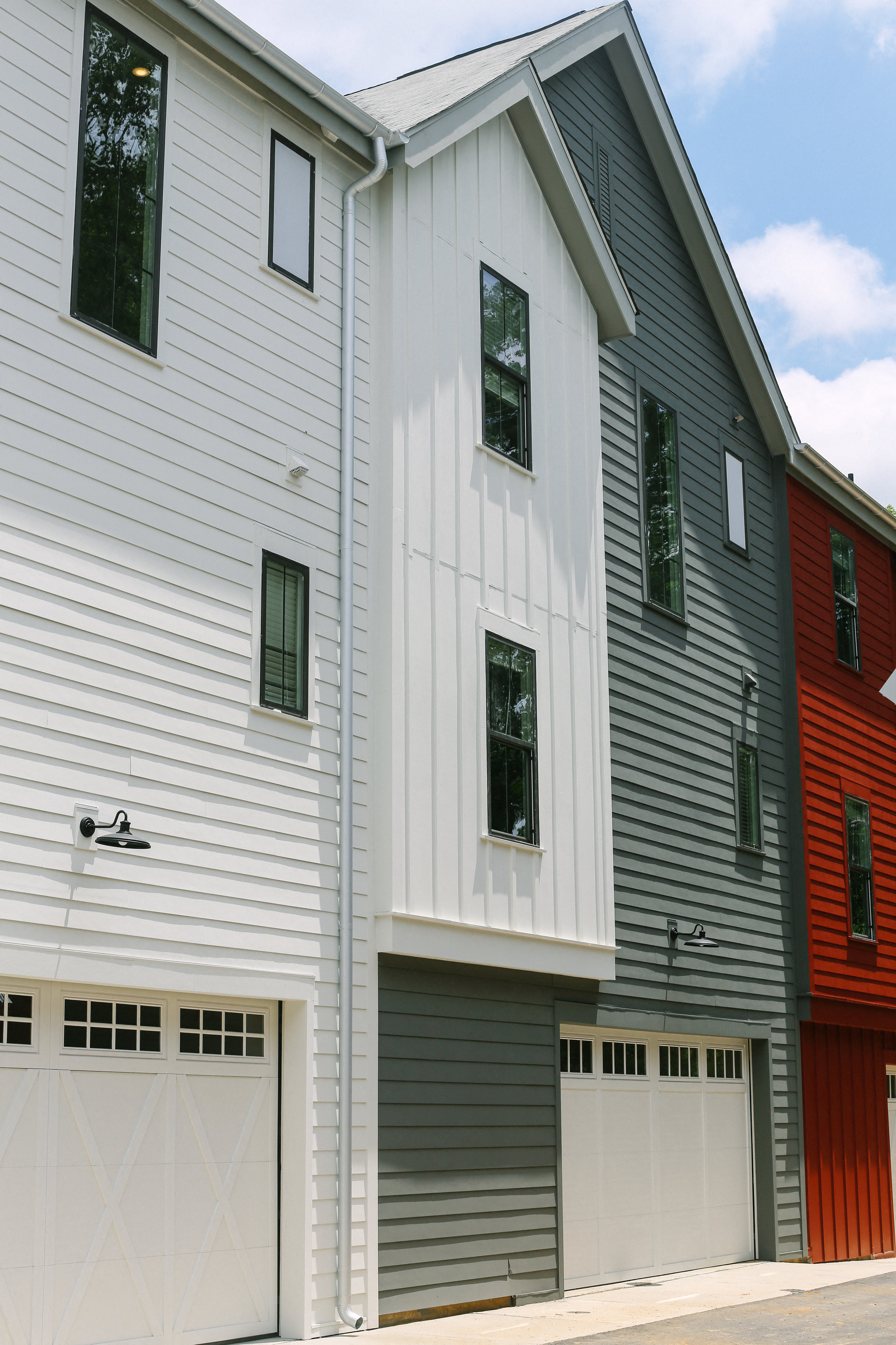 a white and with a white garage door