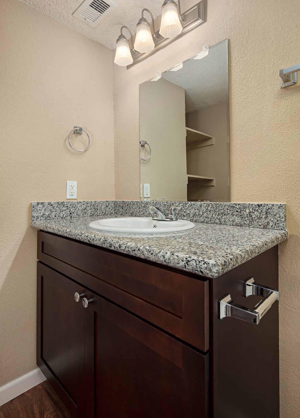 a bathroom with a sink and mirror