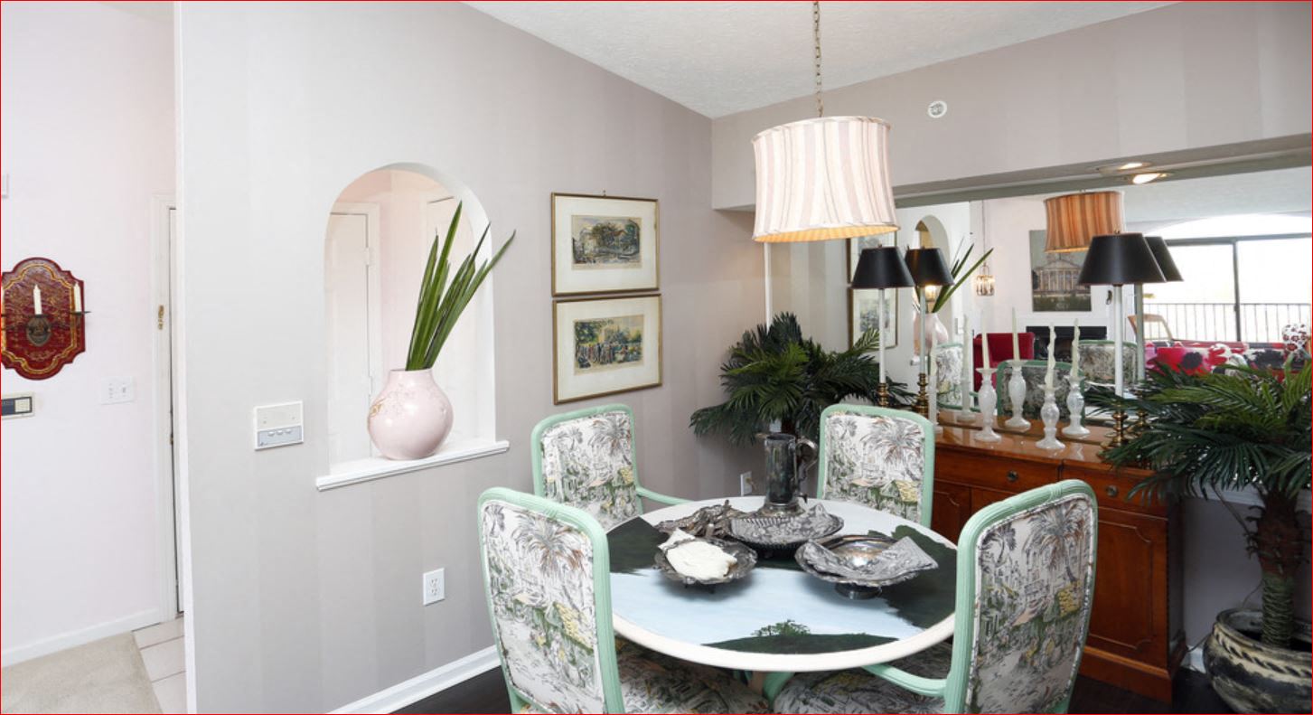 a dining room with a table and chairs