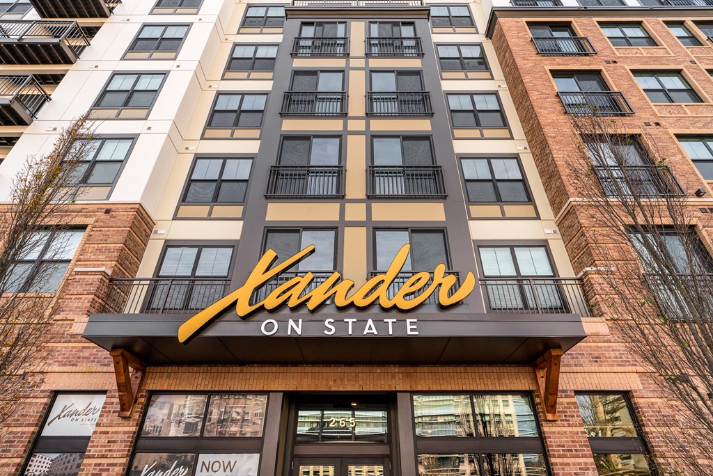 the exterior of a building with a landlords on state sign