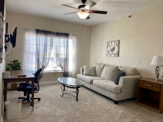 a living room with a couch and a table