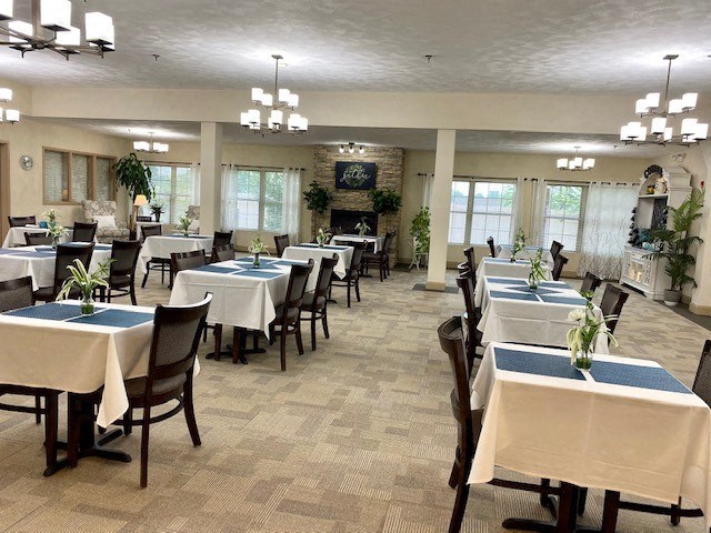 a large dining room with tables and chairs