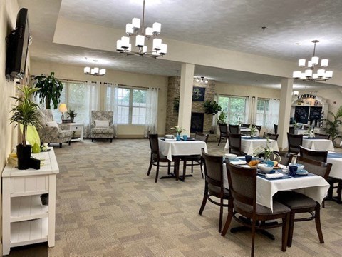 a large dining room with tables and chairs