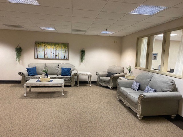 a living room with couches and a table