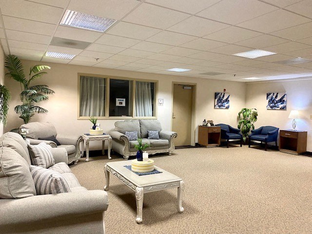 a living room filled with furniture and a table
